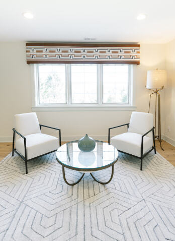 sitting area with two chairs